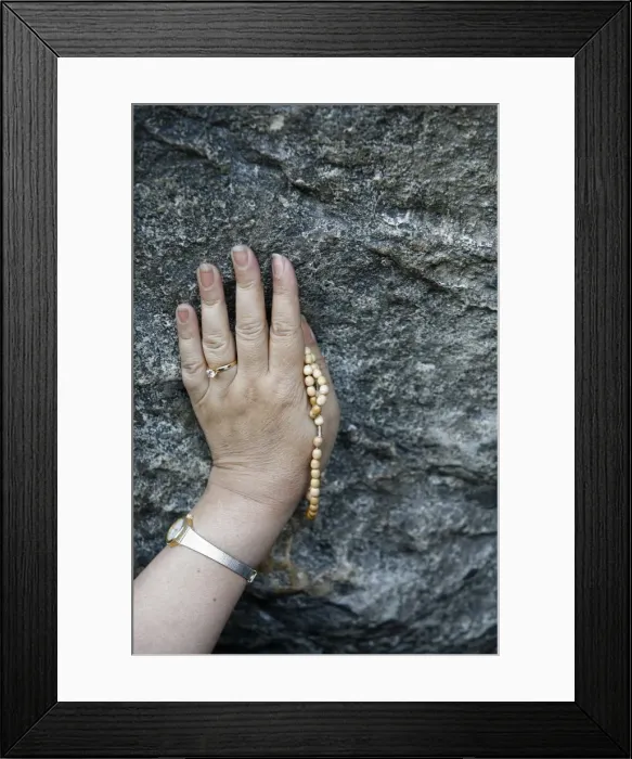 Framed Print : Pilgrim touching the Lourdes grotto, Lourdes, Hautes Pyrenees, France, Europe Framed Print : Pilgrim touching the Lourdes grotto, Lourdes, Hautes Pyrenees, France, Europe