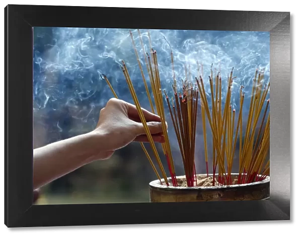 Emperor Jade pagoda (Chua Phuoc Hai), incense sticks on joss stick pot burning