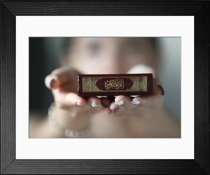 Framed Print : Muslim woman holding the Holy Quran book, Indochina, Southeast Asia, Asia Framed Print : Muslim woman holding the Holy Quran book, Indochina, Southeast Asia, Asia