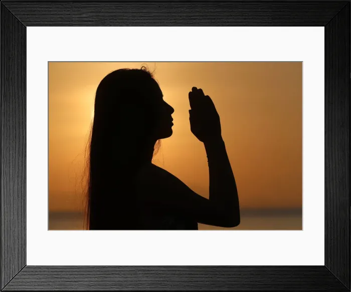 Framed Print : Silhouette of a woman standing by the sea at sunset doing yoga pose and meditation, Kep Framed Print : Silhouette of a woman standing by the sea at sunset doing yoga pose and meditation, Kep