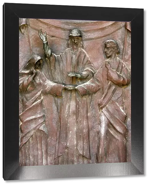 Sculpture of the wedding of Joseph and Mary on the door of the Annunciation Basilica