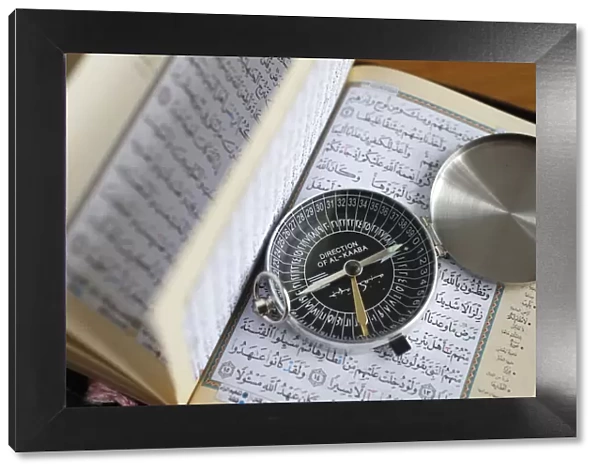 Quran and a Qibla compass to indicate the direction of Mecca, Vietnam, Indochina