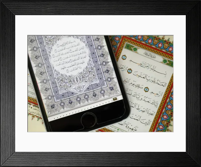 Framed Print : Digital Quran on a smartphone and Holy Quran book, Surat al-Fatiah, the first chapter Framed Print : Digital Quran on a smartphone and Holy Quran book, Surat al-Fatiah, the first chapter
