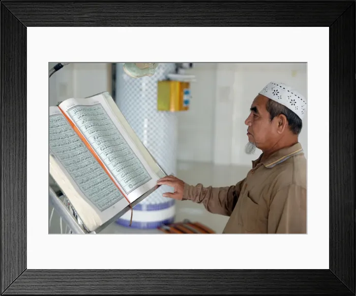 Framed Print : Masjid Nurul Naim Mosque, Imam reading the Quran, Phnom Penh, Cambodia, Indochina Framed Print : Masjid Nurul Naim Mosque, Imam reading the Quran, Phnom Penh, Cambodia, Indochina