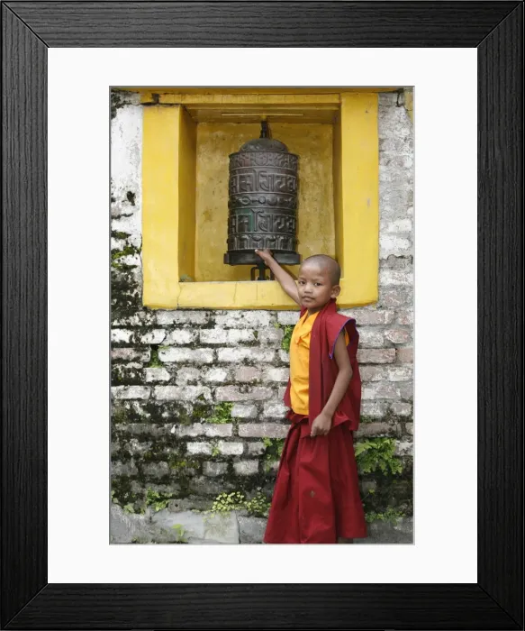 Framed Print : Young monk and prayer wheel, Swayambhunath temple, Kathmandu, Nepal, Asia Framed Print : Young monk and prayer wheel, Swayambhunath temple, Kathmandu, Nepal, Asia