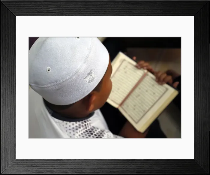 Framed Print : Muslim boy learning Quran at Islamic school, with Kufi hat, Ho Chi Minh City, Vietnam Framed Print : Muslim boy learning Quran at Islamic school, with Kufi hat, Ho Chi Minh City, Vietnam
