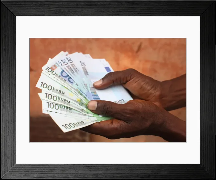 Framed Print : African holding Euros, Lome, Togo, West Africa, Africa Framed Print : African holding Euros, Lome, Togo, West Africa, Africa