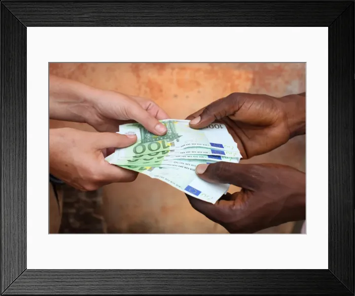 Framed Print : African holding Euros, Lome, Togo, West Africa, Africa