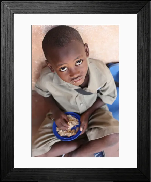Framed Print : Child eating a meal in a primary school in Africa, Lome, Togo, West Africa, Africa Framed Print : Child eating a meal in a primary school in Africa, Lome, Togo, West Africa, Africa