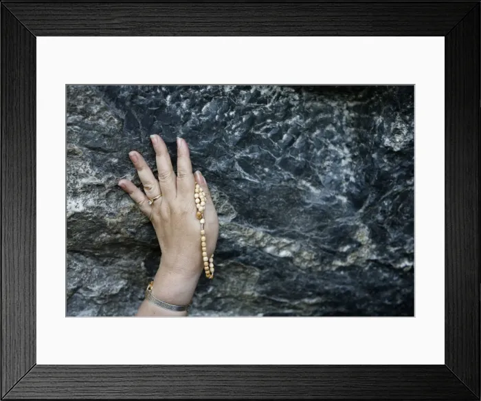 Framed Print : Pilgrim touching the Lourdes grotto, Lourdes, Hautes Pyrenees, France, Europe Framed Print : Pilgrim touching the Lourdes grotto, Lourdes, Hautes Pyrenees, France, Europe