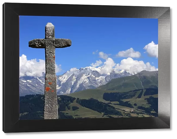 Stone cross on the Jaillet facing Mont Blanc, Megeve, Haute-Savoie, France, Europe