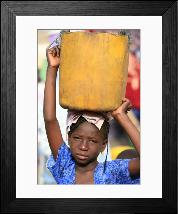 Framed Print : Girl carrying a heavy load, St. Louis, Senegal, West Africa, Africa Framed Print : Girl carrying a heavy load, St. Louis, Senegal, West Africa, Africa