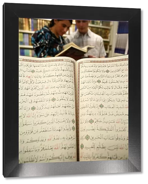 Couple reading the Koran at U. O. I. F. annual meeting, Paris, France, Europe