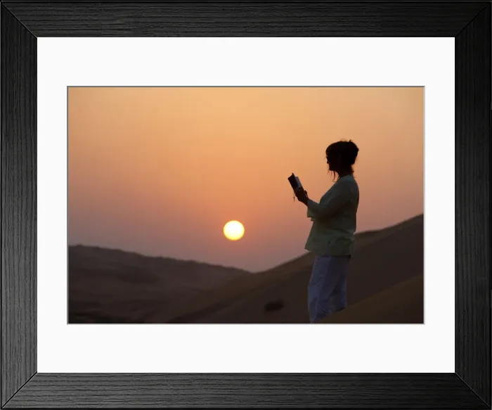 Framed Print : Woman reading the Bible in the desert, Abu Dhabi, United Arab Emirates, Middle East Framed Print : Woman reading the Bible in the desert, Abu Dhabi, United Arab Emirates, Middle East