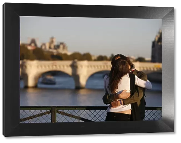 Lovers on Paris bridge, Paris, France, Europe