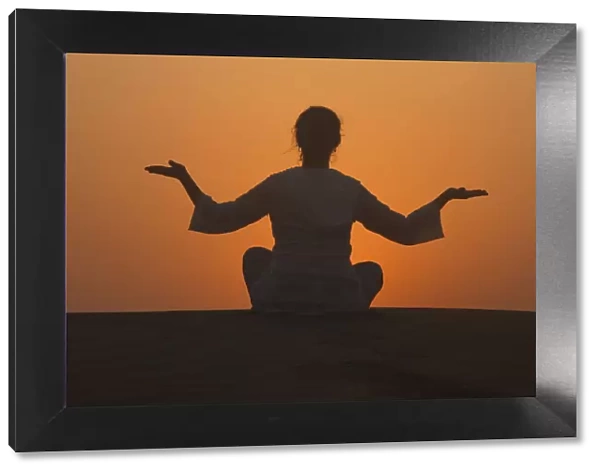 Sunset meditation in the desert, Abu Dhabi, United Arab Emirates, Middle East