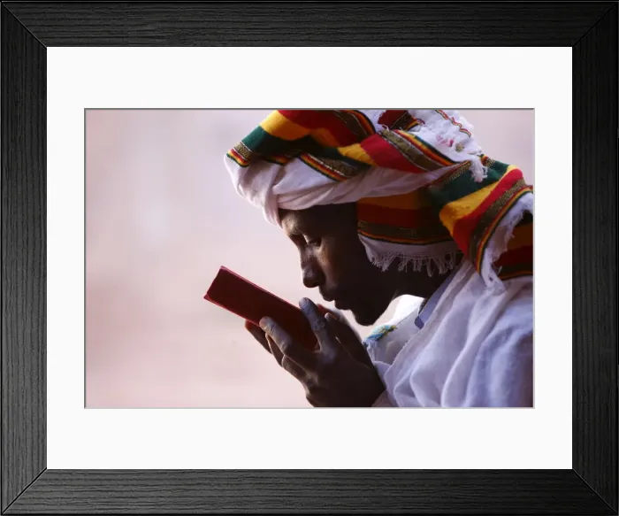 Framed Print : Faithful kissing a Bible outside a church in Lalibela, Ethiopia, Africa Framed Print : Faithful kissing a Bible outside a church in Lalibela, Ethiopia, Africa