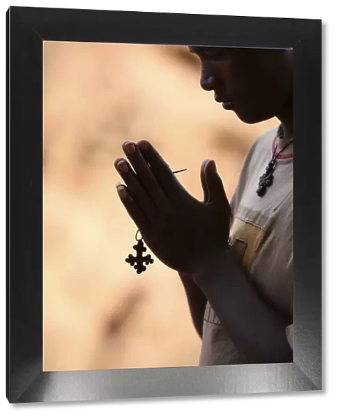 Young man praying in Lalibela, Ethiopia, Africa