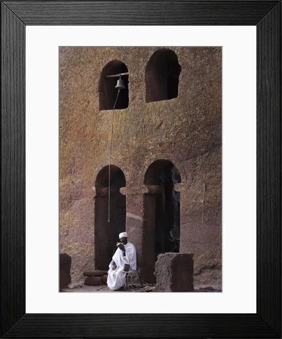 Framed Print : Priest reading a Bible in Bet Maryam church courtyard, UNESCO World Heritage Site Framed Print : Priest reading a Bible in Bet Maryam church courtyard, UNESCO World Heritage Site