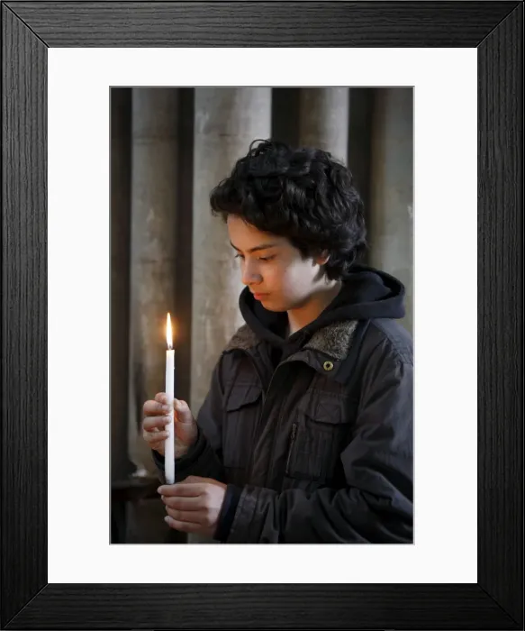 Framed Print : Teenager holding a candle in Notre Dame de Bayeux cathedral, Bayeux, Normandy, France Framed Print : Teenager holding a candle in Notre Dame de Bayeux cathedral, Bayeux, Normandy, France