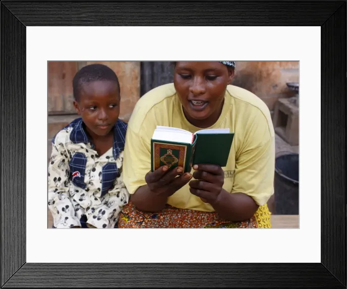 Framed Print : African mother reading the Koran, Lome, Togo, West Africa, Africa Framed Print : African mother reading the Koran, Lome, Togo, West Africa, Africa