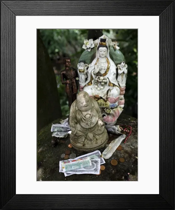 Framed Print : Money offering and statues in the garden of Buddhapadipa temple, Wimbledon, London Framed Print : Money offering and statues in the garden of Buddhapadipa temple, Wimbledon, London