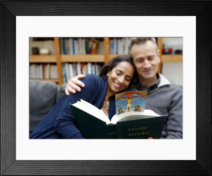 Framed Print : Couple reading the Bible at home, Paris, France, Europe Framed Print : Couple reading the Bible at home, Paris, France, Europe