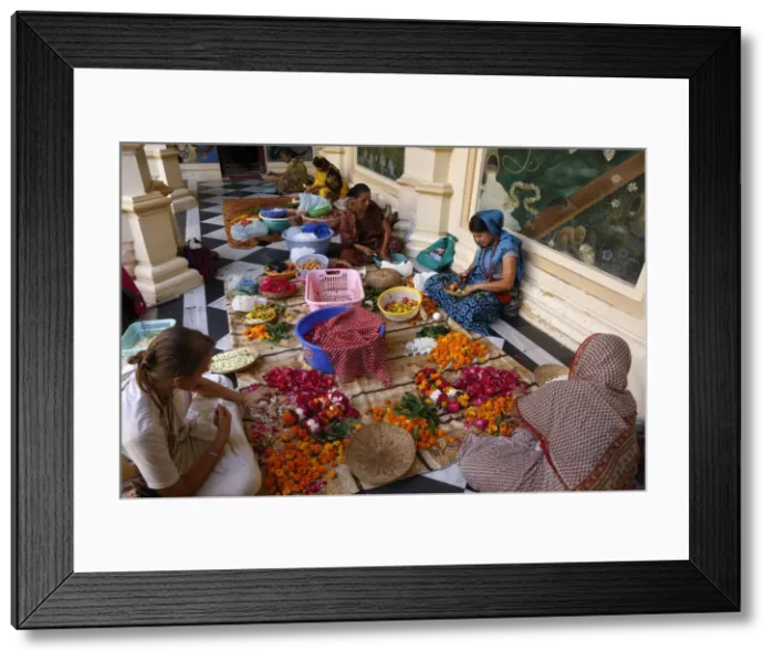 Framed Print : Devotees making garlands at Krishna-Balaram Hindu temple, Vrindavan, Uttar Pradesh, India