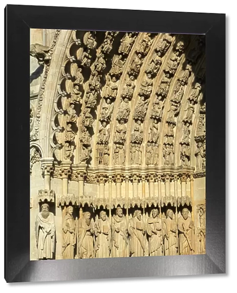 Statues of apostles and prophets in the splay and the left sidewall of the central portal