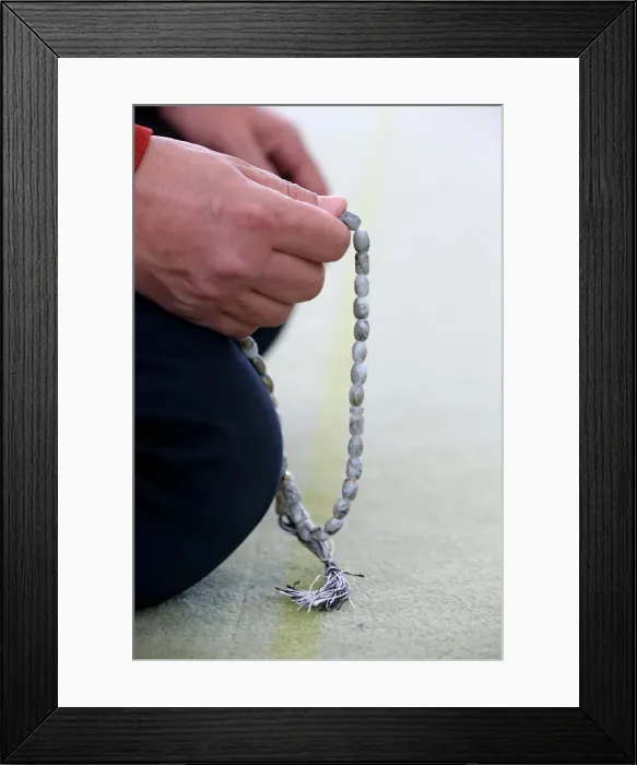 Framed Print : Man praying in a mosque with Tasbih (prayer beads), Bussy-Sainte-Georges, Seine-et-Marne Framed Print : Man praying in a mosque with Tasbih (prayer beads), Bussy-Sainte-Georges, Seine-et-Marne