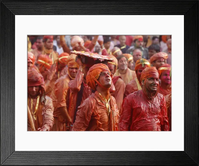 Framed Print : Barsana villagers celebrating Holi in Nandgaon, taunting Nandgaon villagers who throw Framed Print : Barsana villagers celebrating Holi in Nandgaon, taunting Nandgaon villagers who throw