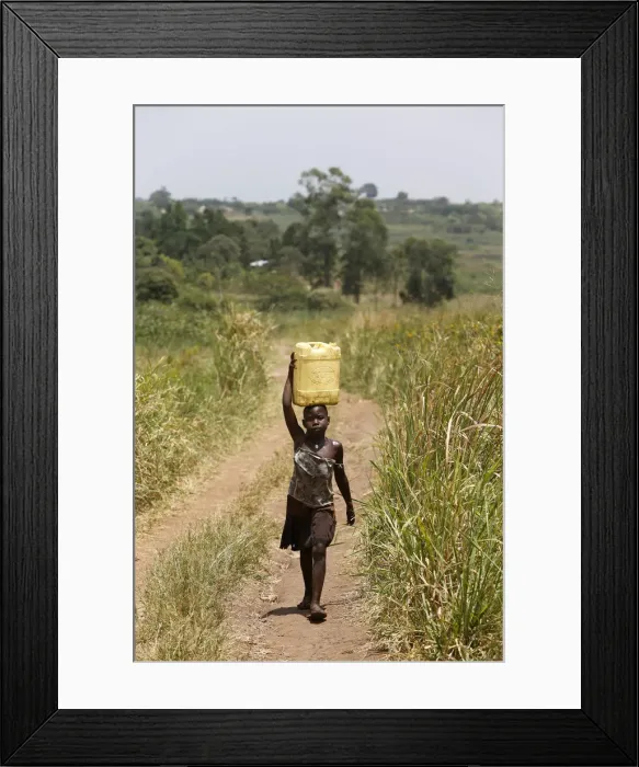 Framed Print : Ugandan child fetching water, Masindi, Uganda, Africa Framed Print : Ugandan child fetching water, Masindi, Uganda, Africa