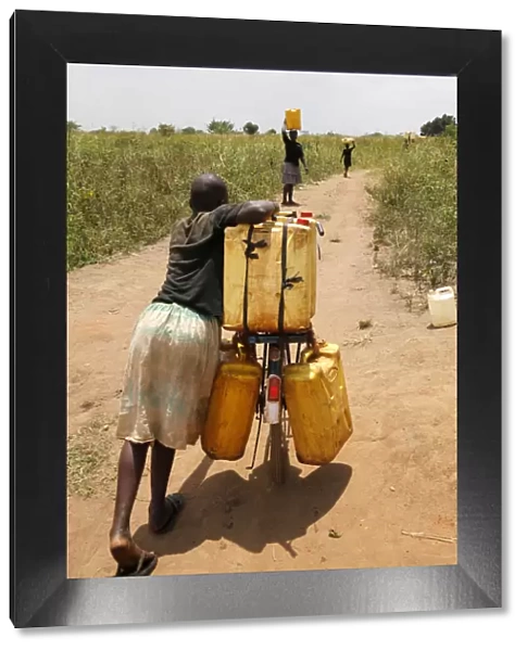 Water chore, Masindi, Uganda, Africa