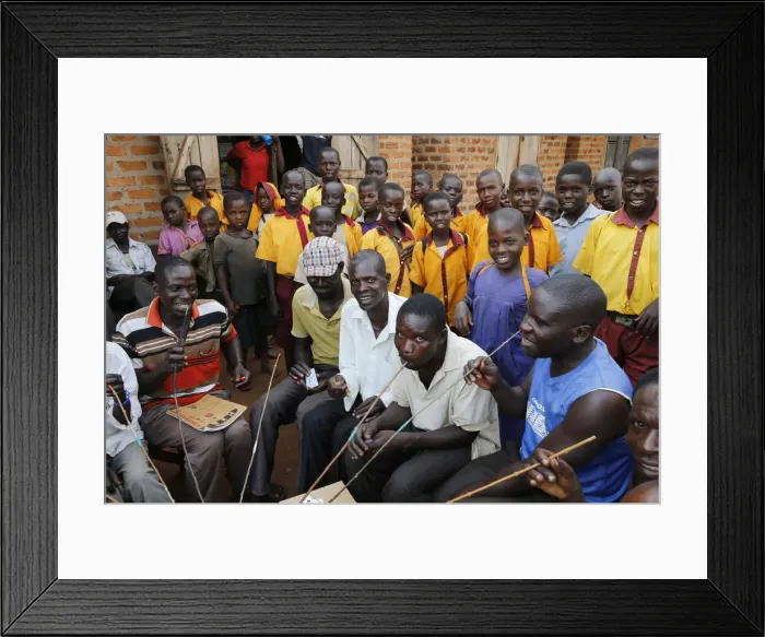 Framed Print : Ugandan villagers drinking home-brewed beer and schoolchildren, Bweyale, Uganda, Africa Framed Print : Ugandan villagers drinking home-brewed beer and schoolchildren, Bweyale, Uganda, Africa