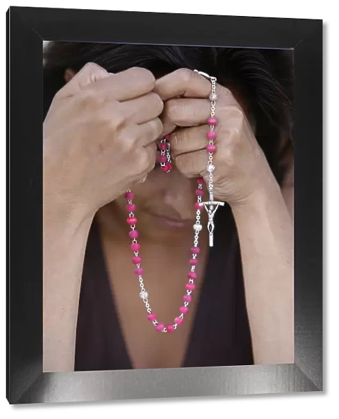 Woman with prayer beads