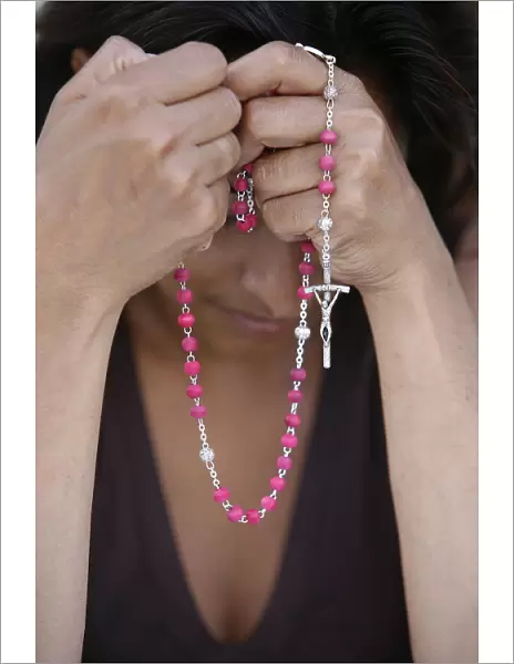 Woman with prayer beads