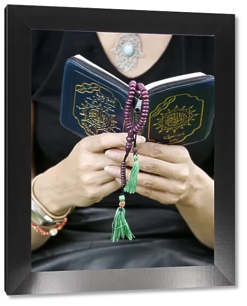 Woman reading the Koran