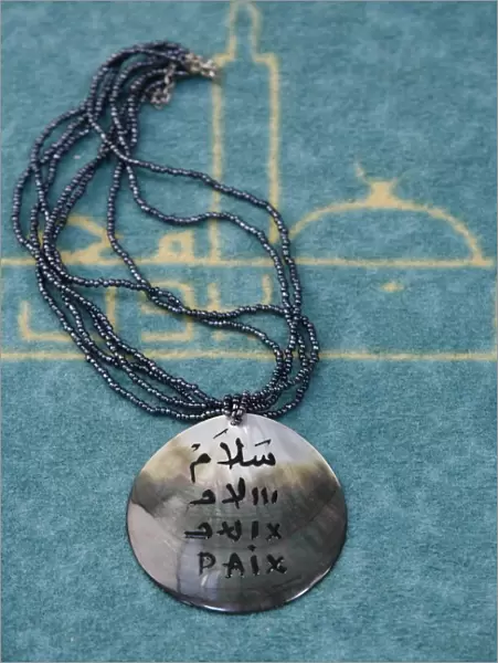 Pendant inscribed with peace in Arabic and French, Lyon, Rhone, France, Europe