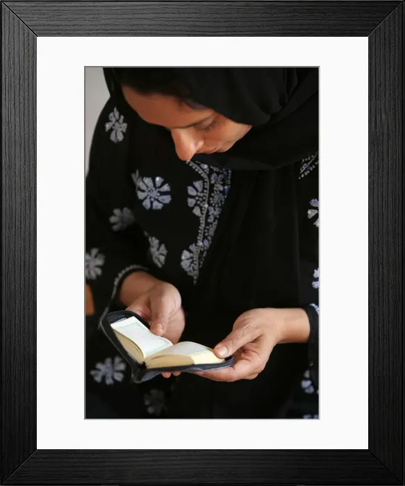 Framed Print : Veiled woman reading Koran, Montrouge, Hauts de Seine, France, Europe