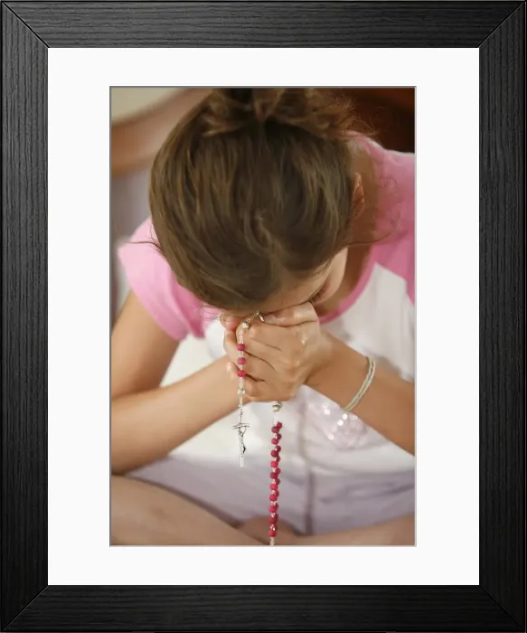 Framed Print : Praying girl, France, Europe Framed Print : Praying girl, France, Europe