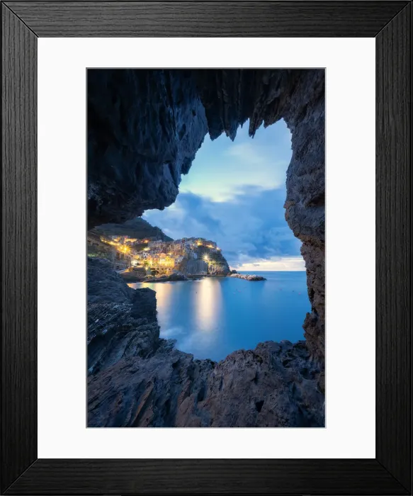 Framed Print : Dusk lights over Manarola seen from a sea cave, Cinque Terre, UNESCO World Heritage Site Framed Print : Dusk lights over Manarola seen from a sea cave, Cinque Terre, UNESCO World Heritage Site