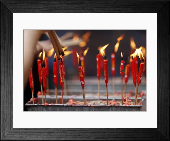 Framed Print : Chinese man burning incense and praying to a prosperous future Framed Print : Chinese man burning incense and praying to a prosperous future