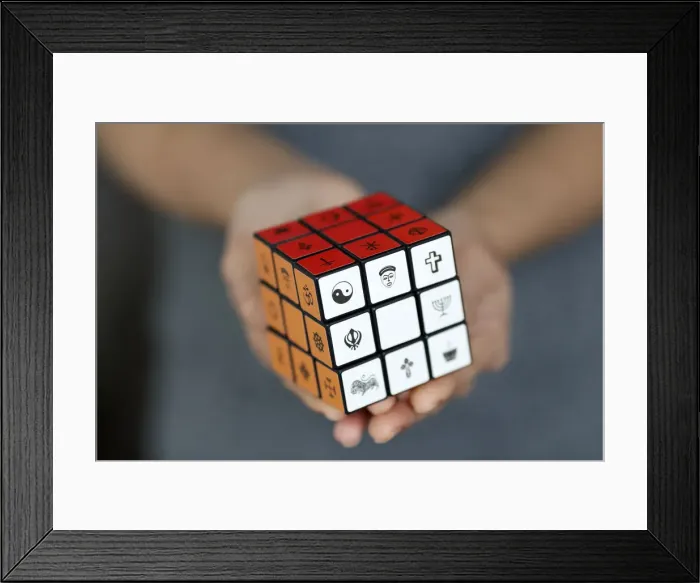 Framed Print : Woman with a Rubiks cube with religious symbols, Interreligious Framed Print : Woman with a Rubiks cube with religious symbols, Interreligious