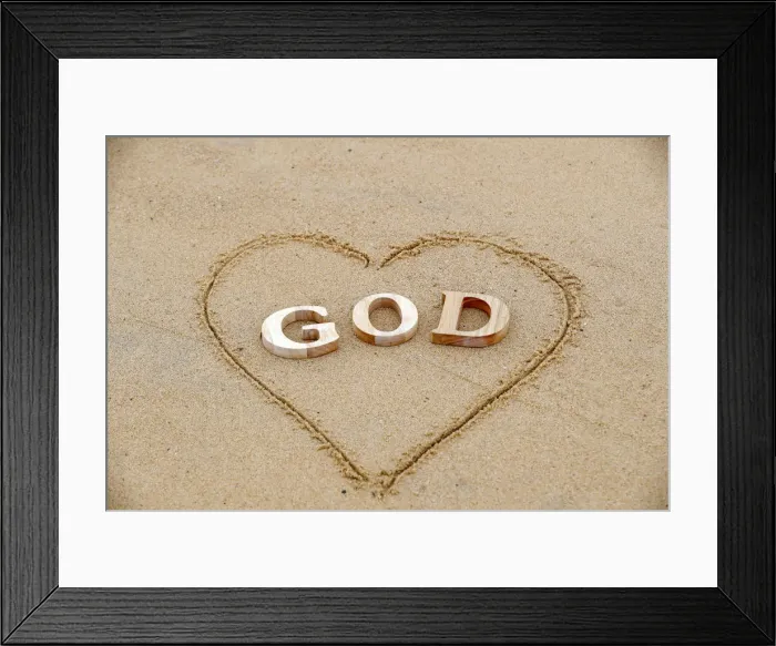 Framed Print : Wooden letters forming the word GOD with heart on a background of beach sand Framed Print : Wooden letters forming the word GOD with heart on a background of beach sand
