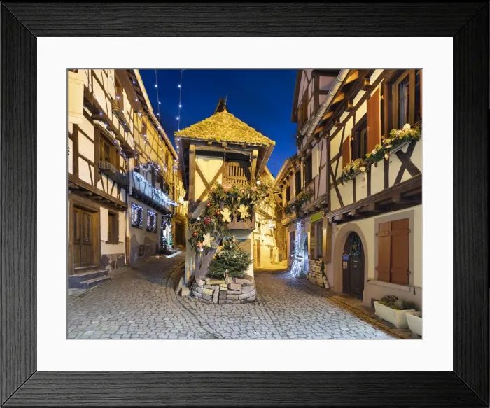 Framed Print : Half-timbered houses along Rue du Rempart Sud lit up with Christmas decorations at night Framed Print : Half-timbered houses along Rue du Rempart Sud lit up with Christmas decorations at night