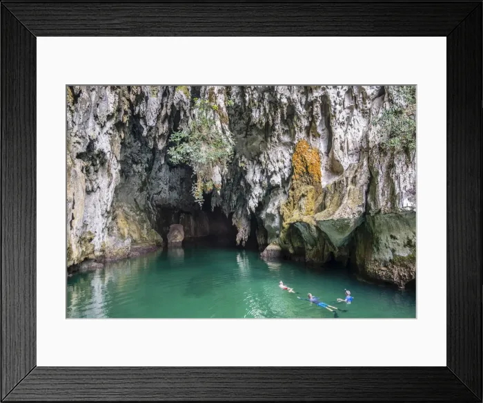 Framed Print : Snorkellers at the entrance to Tomolo (Goa Keramat) cave, Tomolo, Misool, West Papua Framed Print : Snorkellers at the entrance to Tomolo (Goa Keramat) cave, Tomolo, Misool, West Papua