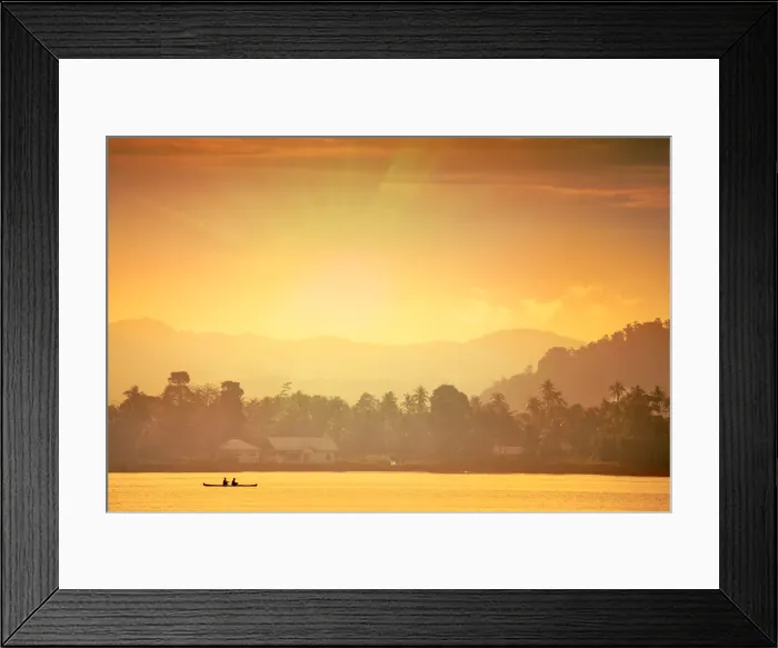 Framed Print : A local fisherman in a traditional canoe in front of the ridges of the Banda islands Framed Print : A local fisherman in a traditional canoe in front of the ridges of the Banda islands