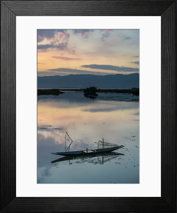 Framed Print : Clouds and traditional rowing boat reflecting in the water at sunset, Inle Lake