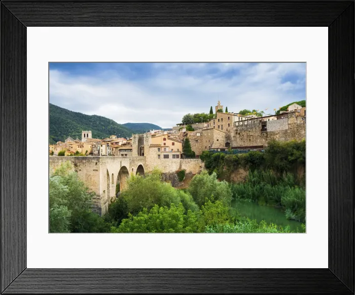 Framed Print : The medieval bridge and fortified old stone city of Besalu in the foothills of