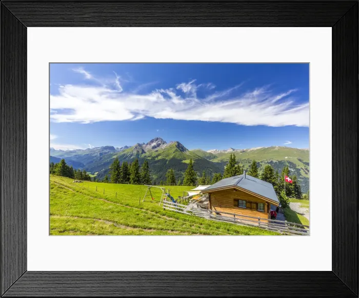Framed Print : Alpine hut with Swiss flag beneath stunning clouds, Urses, Surselva, Graubunden Framed Print : Alpine hut with Swiss flag beneath stunning clouds, Urses, Surselva, Graubunden